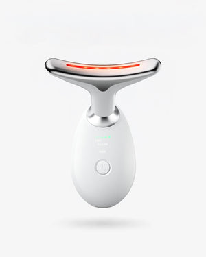 White and silver facial massager with red light on a white background